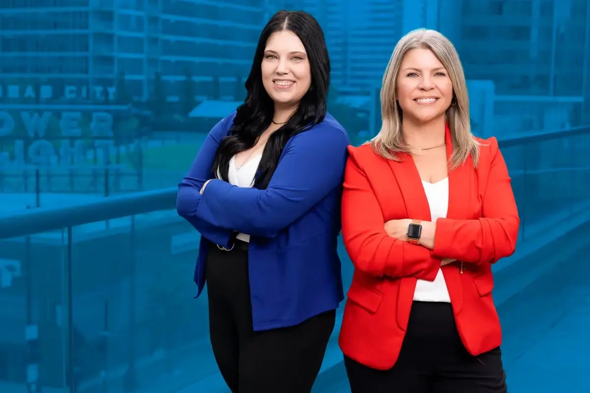 Jeanette Coleman, SPHR, SHRM-SCP, Director of HR at Axcet HR Solutions, with a team member discussing 401(k) employer match options