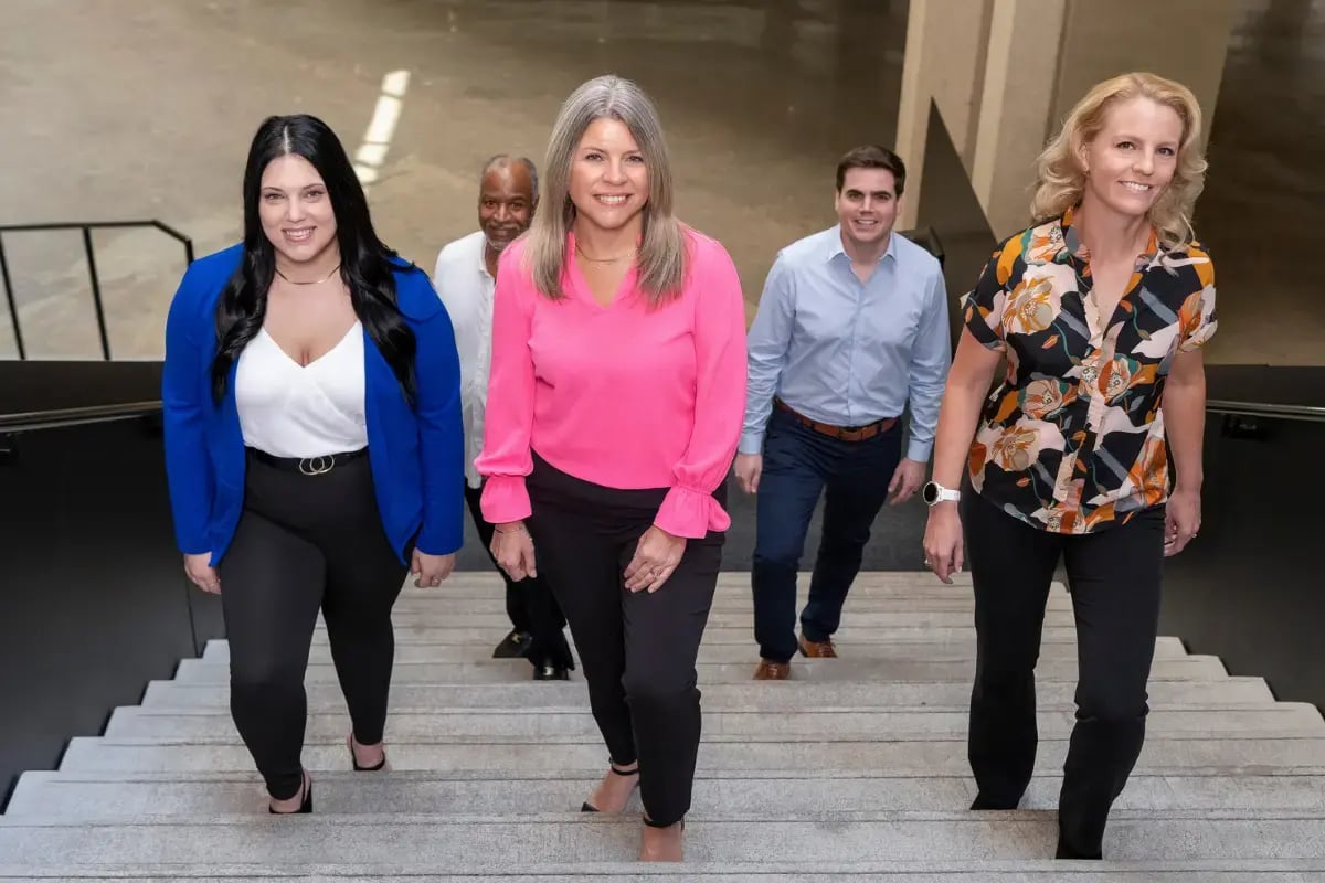 Axcet HR Solutions team collaborating on small business strategy discussing the benefits of 401(k)s for employers.