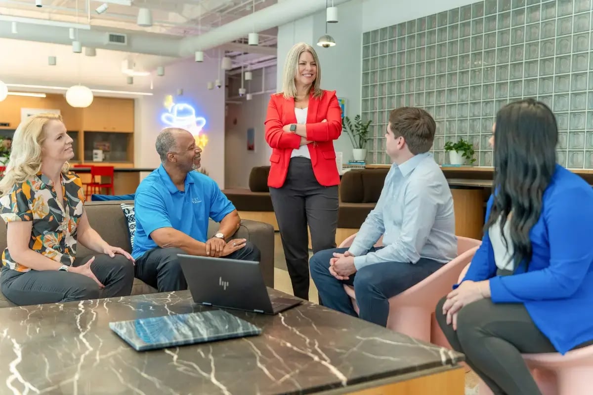 HR leader and team collaborating on how to address employee dress code violations