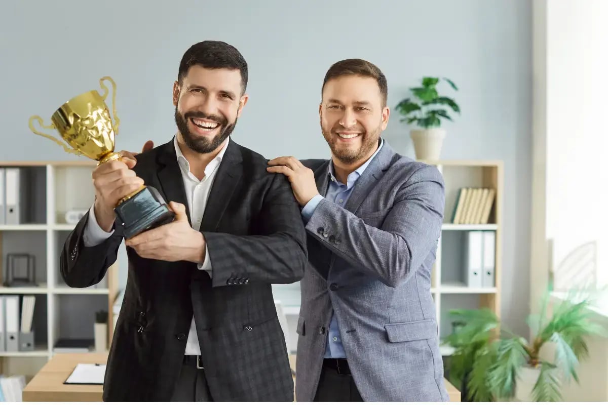 Boss favoring one employee with an oversized trophy, showing favoritism at work.