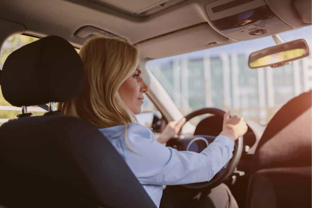 woman driving personal car for business purposes