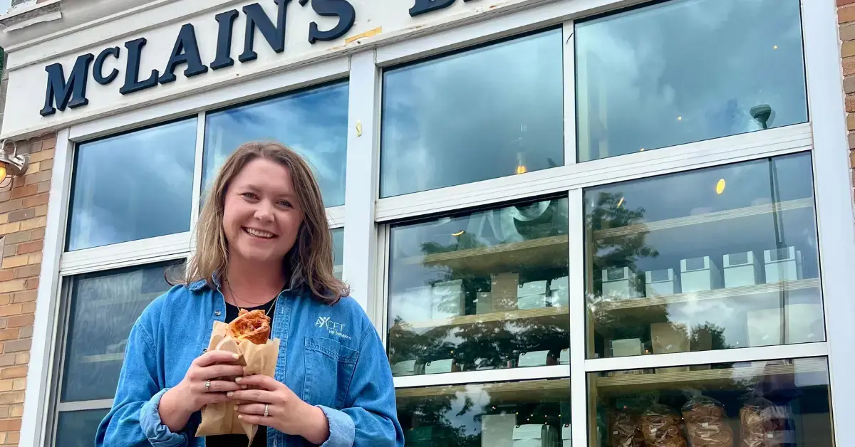 Axcet team member outside McLain's Bakery that was just voted best bakery in Kansas City in our in-office poll