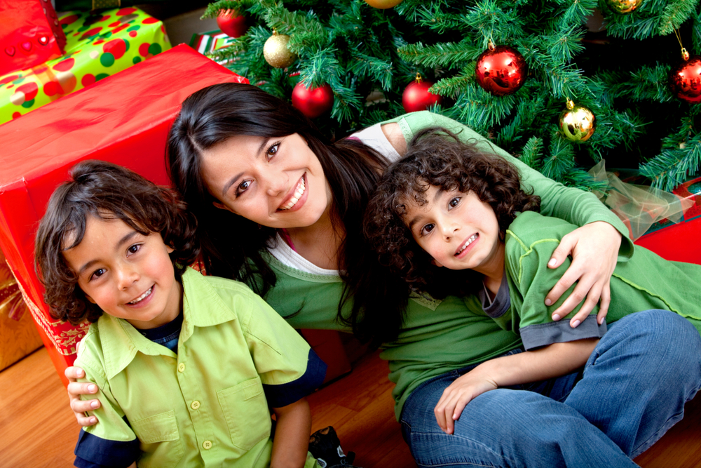 Christmas portrait of a woman with two boys smiling