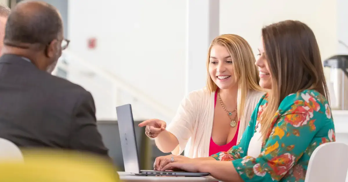 Small business owner researching how to compare health insurance plans for employees