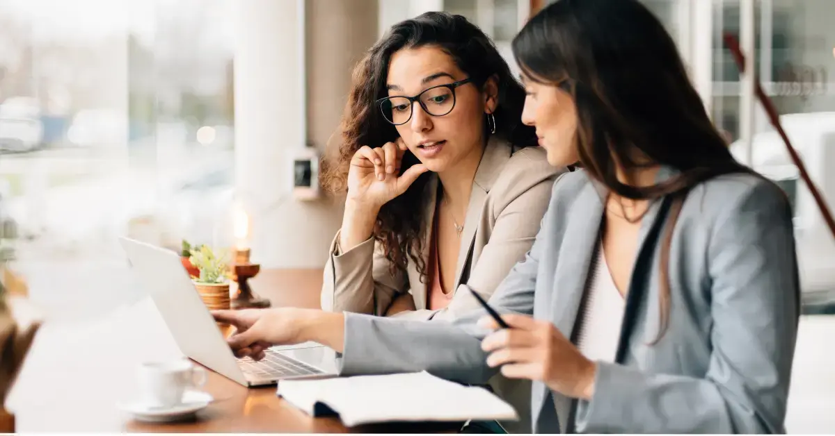 Engaged employees in a small business office, supported by affordable small business health insurance through a PEO partnership